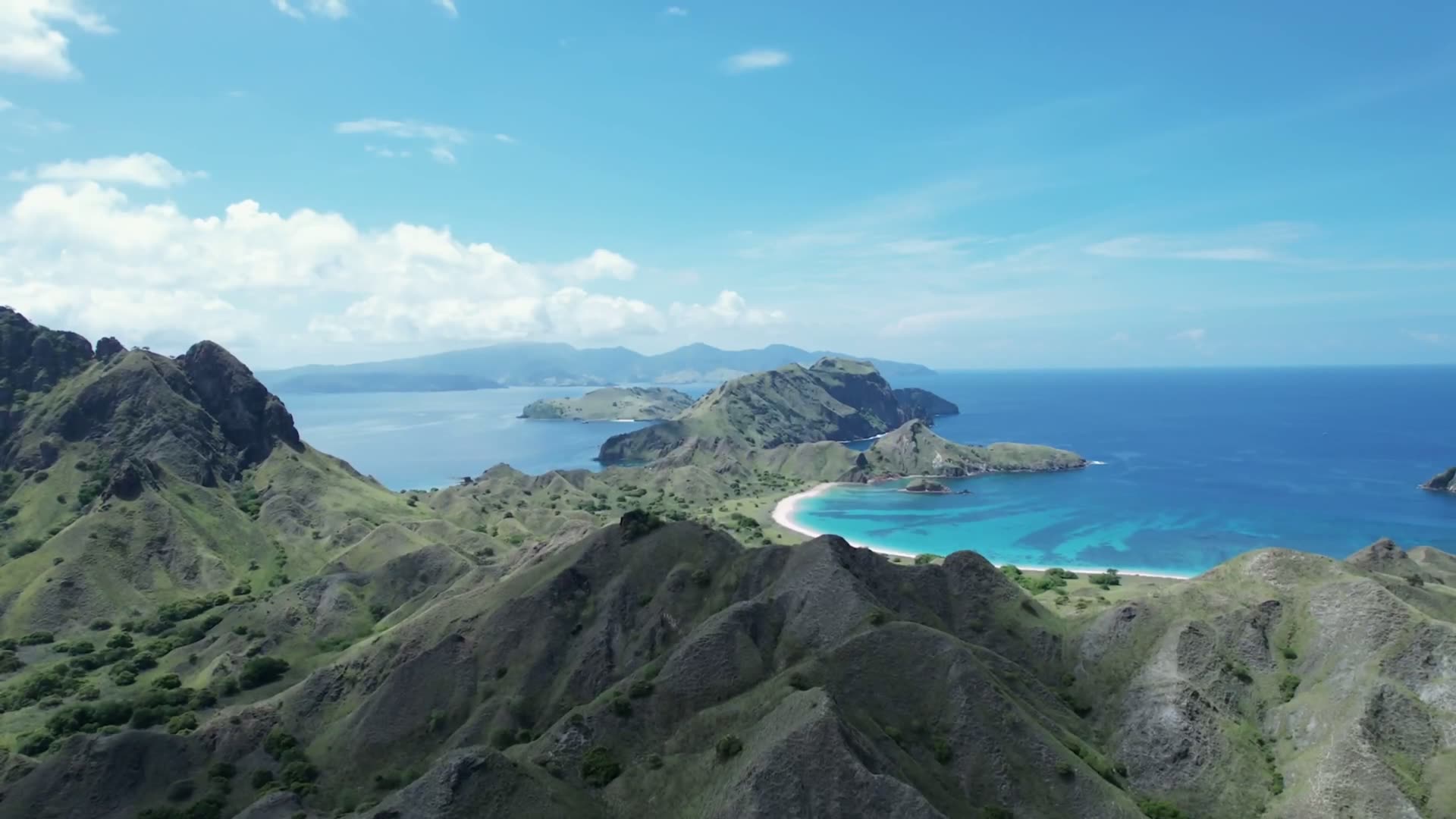 Aerial view of a turquoise Lombok bay at golden hour